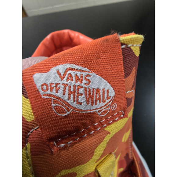 Vans Sk8-Hi high-top sneakers in an orange and yellow camouflage